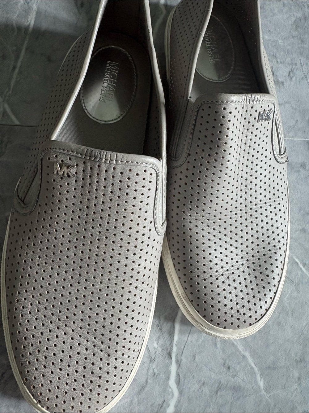 Michael Kors women’s Perforated Slip-On Loafers in Light Taupe